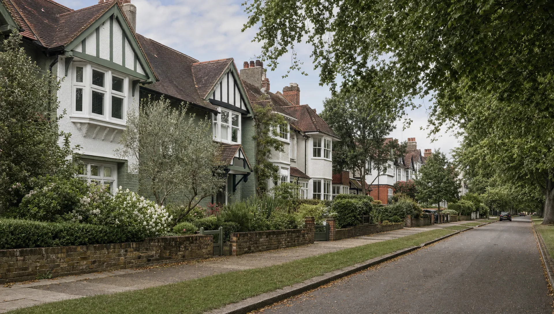 A quiet West London suburban street near Ickenham shows period family homes, front gardens and mature trees as a village-home setting.