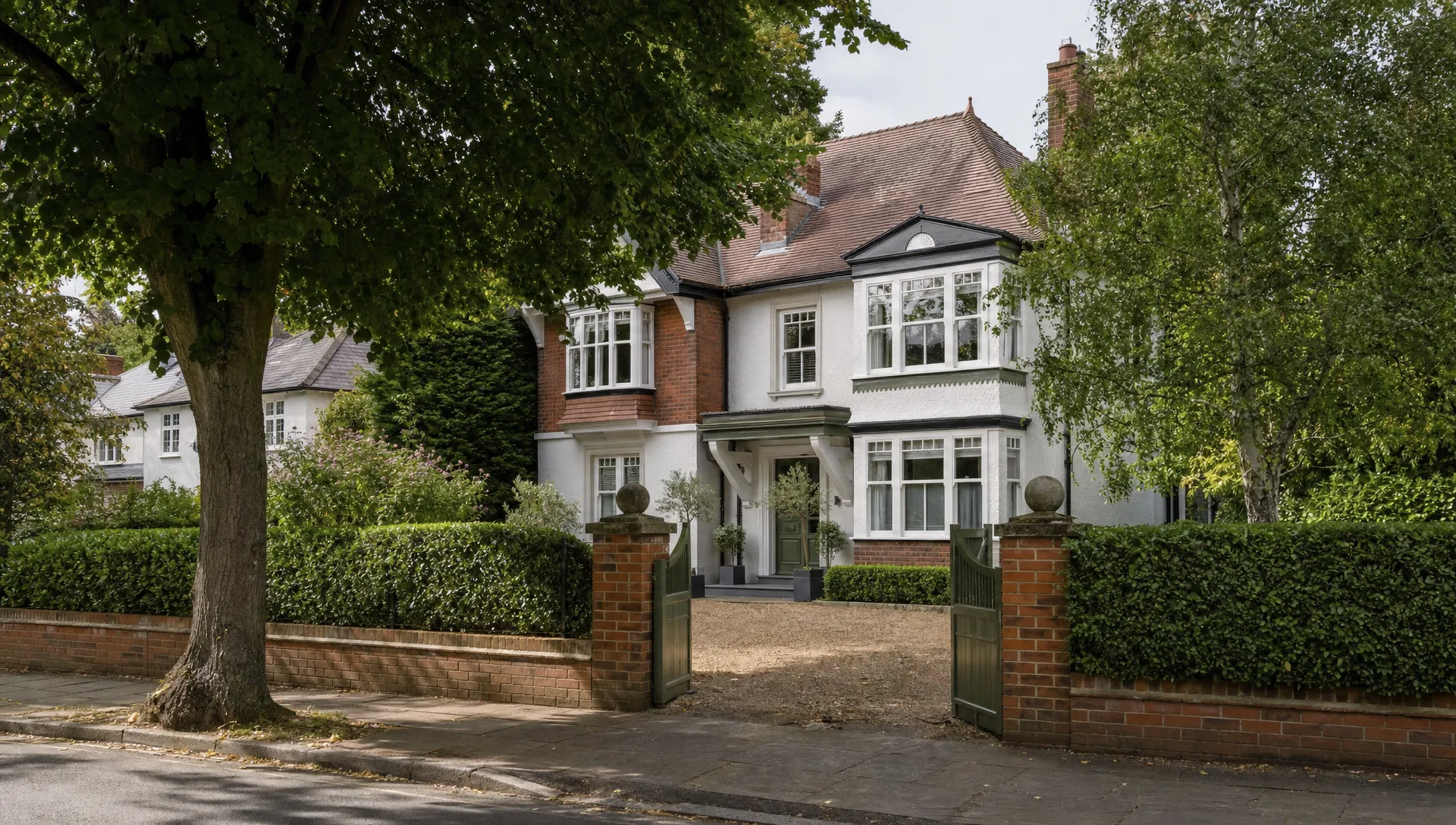 A detached period home in Ickenham with a mature front garden and tree-lined road, showing a luxury property for sale.