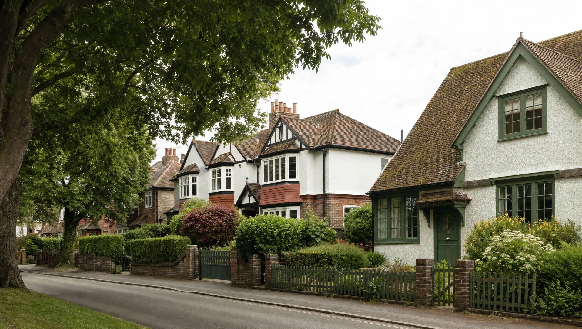 A quiet tree-lined street in Ickenham with 1930s semis and a period cottage, showing the homes whose sales agents help progress after an offer.